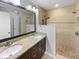 Elegant bathroom features a double sink vanity and walk-in shower at 770 Tulip Ln, Greenwood, IN 46143