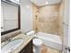 Stylish bathroom with stone tile in shower and around the room with decorative horizontal tile at 770 Tulip Ln, Greenwood, IN 46143