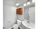 Cozy bathroom with a vanity, toilet, and a cabinet at 770 Tulip Ln, Greenwood, IN 46143