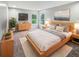 Serene bedroom with plush carpeting, natural light, and stylish wooden furniture at 770 Tulip Ln, Greenwood, IN 46143