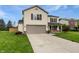 Attractive two-story home with an attached garage and manicured lawn at 770 Tulip Ln, Greenwood, IN 46143