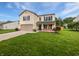 Charming two-story home with a well-manicured lawn and attached two-car garage at 770 Tulip Ln, Greenwood, IN 46143