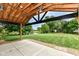 An outdoor patio featuring a view of the fenced in backyard, pond, and green grass at 7755 Dayflower Ct, Noblesville, IN 46062