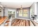 Cozy dining area with wood floors, natural light, and a view of the backyard at 7755 Dayflower Ct, Noblesville, IN 46062