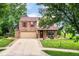 Charming two-story home features brick and siding exterior, two-car garage, and well-maintained front yard at 7755 Dayflower Ct, Noblesville, IN 46062