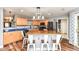 Well-appointed kitchen with an island, wood cabinets, blue countertops, and stainless steel appliances at 7755 Dayflower Ct, Noblesville, IN 46062