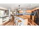 Open concept kitchen with a large island, butcher block countertop, and stainless steel appliances at 7755 Dayflower Ct, Noblesville, IN 46062