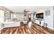 Cozy living room with hardwood floors, a sectional sofa, and tasteful decor at 7755 Dayflower Ct, Noblesville, IN 46062