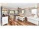 Spacious living room boasts hardwood floors, stylish furniture, and ample natural light at 7755 Dayflower Ct, Noblesville, IN 46062