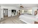 Comfortable main bedroom with neutral colors, large windows, and a ceiling fan at 7755 Dayflower Ct, Noblesville, IN 46062