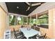 Enclosed patio features black metal furniture and views of the backyard at 7755 Dayflower Ct, Noblesville, IN 46062