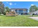Backyard featuring a spacious lawn and wooden deck at 8140 Bold Forbes Ct, Indianapolis, IN 46217