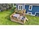 Multi-level deck with seating around the hot tub in the backyard at 8140 Bold Forbes Ct, Indianapolis, IN 46217
