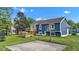 Image of the backyard features a well-maintained lawn and a basketball court at 8140 Bold Forbes Ct, Indianapolis, IN 46217