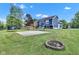 Large backyard with basketball court, fire pit, and well-maintained lawn at 8140 Bold Forbes Ct, Indianapolis, IN 46217