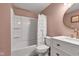 Bathroom features a shower-tub combo with modern vanity and decor at 8140 Bold Forbes Ct, Indianapolis, IN 46217