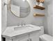 The bathroom features a white marble countertop, modern fixtures, and a gold-rimmed mirror at 8140 Bold Forbes Ct, Indianapolis, IN 46217