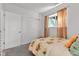 Comfortable bedroom with soft natural lighting, closet space, and a floral comforter at 8140 Bold Forbes Ct, Indianapolis, IN 46217