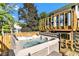 Deck features a hot tub, with stairs leading to the backyard at 8140 Bold Forbes Ct, Indianapolis, IN 46217