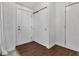 Bright entryway featuring dark wood floors, a closet and front door at 8140 Bold Forbes Ct, Indianapolis, IN 46217