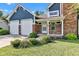 Charming blue two-story home with a brick exterior, a two-car garage and a covered front entrance at 8140 Bold Forbes Ct, Indianapolis, IN 46217
