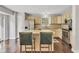 Bright kitchen featuring stainless steel appliances, granite countertops, and cozy breakfast bar at 8140 Bold Forbes Ct, Indianapolis, IN 46217