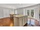 Open kitchen/dining area featuring granite island, stainless appliances and view to backyard at 8140 Bold Forbes Ct, Indianapolis, IN 46217