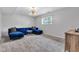The living room features a blue chaise lounge sofa, modern lighting, and neutral-toned walls at 8140 Bold Forbes Ct, Indianapolis, IN 46217