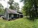 Backyard features a screened-in porch, and a well-maintained lawn at 8407 Campbell Ct, Mooresville, IN 46158