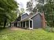 Backyard features a screened-in porch and a brick chimney at 8407 Campbell Ct, Mooresville, IN 46158