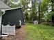 Backyard features a storage shed, well-maintained lawn, and mature trees at 8407 Campbell Ct, Mooresville, IN 46158