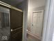 This bathroom shows a glass enclosed shower and closet for storage at 8407 Campbell Ct, Mooresville, IN 46158