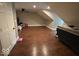 Spacious bedroom with hardwood floors, a ceiling fan, and bright natural light coming through the windows at 8407 Campbell Ct, Mooresville, IN 46158