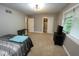 Bedroom with carpet floors, closet, and television at 8407 Campbell Ct, Mooresville, IN 46158