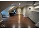 Large bedroom with hardwood floors, ceiling fan, and sloped ceilings offering lots of natural light at 8407 Campbell Ct, Mooresville, IN 46158
