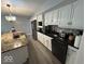 Kitchen features granite countertops, stainless steel appliances, and a breakfast bar at 8407 Campbell Ct, Mooresville, IN 46158