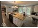 Kitchen with granite countertops, white cabinets, and stainless steel appliances at 8407 Campbell Ct, Mooresville, IN 46158