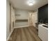 Functional laundry room equipped with a sink, washer, a window, and a built-in shelf at 8407 Campbell Ct, Mooresville, IN 46158