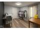 Well-appointed laundry room with a sink, washer, hanging rack, and a view to the outside at 8407 Campbell Ct, Mooresville, IN 46158