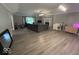 Bright living room with hardwood floors, fireplace, and neutral paint at 8407 Campbell Ct, Mooresville, IN 46158