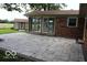 Backyard view of home with brick accents and newly installed paver patio at 8905 Maze Rd, Indianapolis, IN 46259