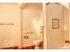 Bathroom with tiled walk-in shower, grab bars, and wood-look flooring at 8905 Maze Rd, Indianapolis, IN 46259