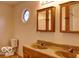 Bathroom featuring double sinks and cabinets for ample storage at 8905 Maze Rd, Indianapolis, IN 46259