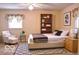 Bedroom with natural light, sitting area, and patterned area rug at 8905 Maze Rd, Indianapolis, IN 46259