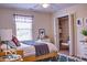 Bedroom with natural light, closet, and patterned bedding at 8905 Maze Rd, Indianapolis, IN 46259
