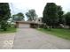 Charming two-story home featuring brick accents, an attached garage, and a well-maintained front lawn at 8905 Maze Rd, Indianapolis, IN 46259