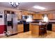 Kitchen with stainless appliances, granite countertops, and bar stool seating at 8905 Maze Rd, Indianapolis, IN 46259
