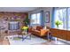 Inviting living room with brick fireplace, hardwood floors, and comfortable modern furniture at 8905 Maze Rd, Indianapolis, IN 46259