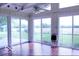 Bright sunroom with large windows and tile flooring overlooking backyard at 8905 Maze Rd, Indianapolis, IN 46259