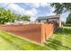 Backyard showing the perimeter fence, grass and home's elevation at 8925 Sunburst Cir, Indianapolis, IN 46227